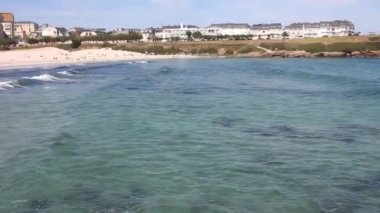 waves reaching the coast in Foz, Spain