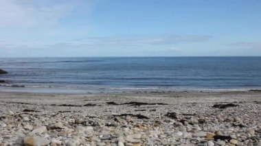 a beach full of round stones