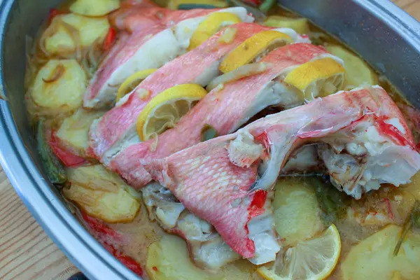 stock image delicious and healthy red bream with potatoes and lemon for lunch