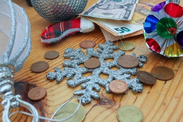 euro coins and dollar and euro notes in Christmas time