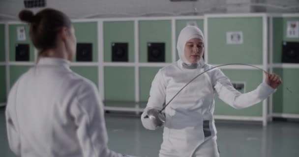 Handheld Shot Young Muslim Sportswoman White Uniform Hijab Bending Foil — Stock Video
