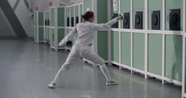 Tracking Shot Full Body Sportswoman White Uniform Hitting Pad Foil — Stock Video