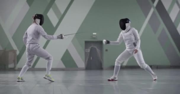 Tracking Shot Sportswomen Uniform Masks Trying Hit Each Other Foils — Stock Video