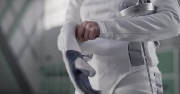 Unrecognizable Sportswoman White Uniform Putting Glove Taking Foil Start Fencing — Stock Video