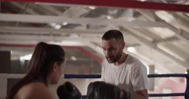 Handheld Shot Bearded Man Punch Mitts Helping Female Boxer Practice — Stock Video