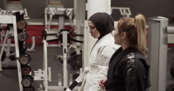Tracking Shot Diverse Women Walking Exercise Machines Speaking Each Other — Stockvideo