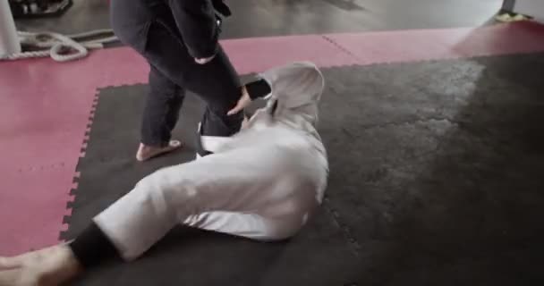Tracking Shot Muslim Wrestler Lying Floor Pushing Away Legs Coach — Stok video