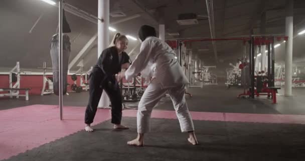 Handheld Shot Barefoot Diverse Female Fighters Doing Secret Handshake Clinching — Video