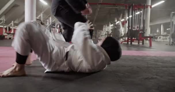 Handheld Shot Muslim Woman Hijab Pushing Away Legs Female Instructor — Stok Video