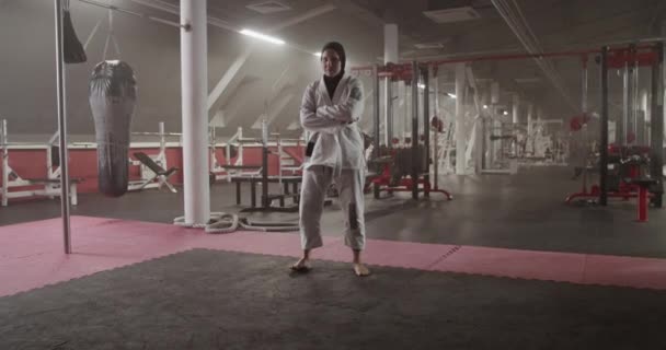 Handheld Shot Muslim Woman Hijab Crossed Arms Standing Spacious Gym — Video Stock