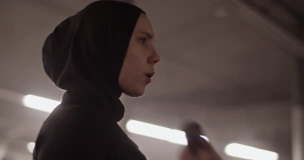 Low Angle Handheld Shot Female Athlete Black Sportswear Hijab Breathing — Stockvideo