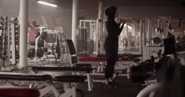 Low Angle Handheld Shot Female Athlete Black Sportswear Hijab Breathing — Video Stock