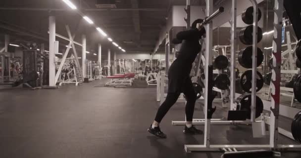 Handheld Shot Muslim Sportswoman Putting Barbell Rack Shoulders Squatting Fitness — Video Stock