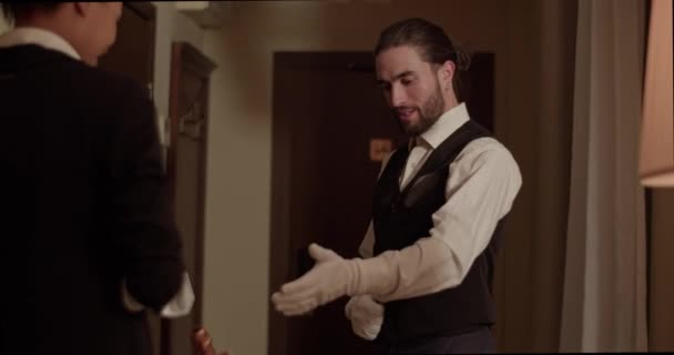 Friendly Bearded Elegant Waiter Long Dark Hair Uniform Gloves Introducing — Wideo stockowe