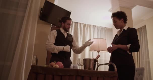 Friendly Bearded Elegant Waiter Long Dark Hair Uniform Gloves Introducing — Vídeo de Stock