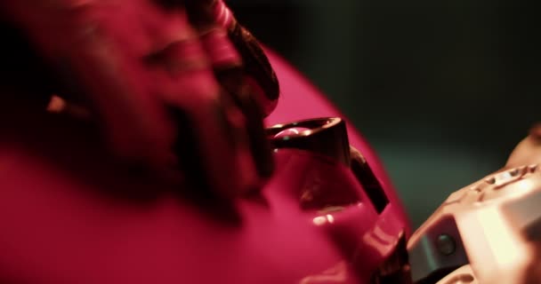 Closeup Handheld Shot Crop Hand Protective Glove Placed Pink Motorbike — Stock Video