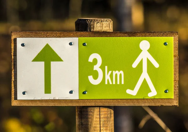 Hiking sign with distance 3 km