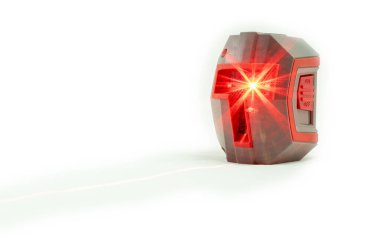 Self leveling cross hair laser on white background