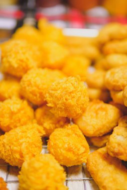 Crispy breaded mozzarella cheese, cheese ball, blurred background