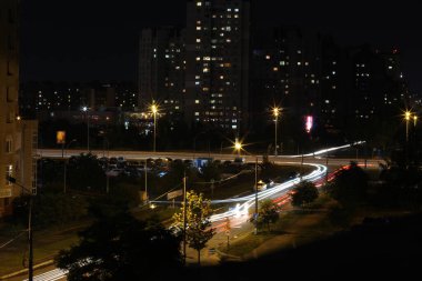 top view of the night streets of Kyiv with car lights clipart