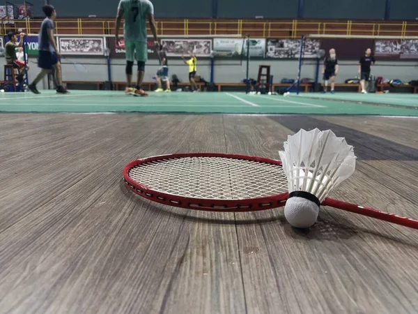 Group Young Men Practicing Badminton Shuttlecocks Rackets Placed Floor Blurred — Stock Photo, Image
