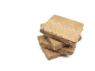 Arka planda gofret ya da çikolatalı waffle.