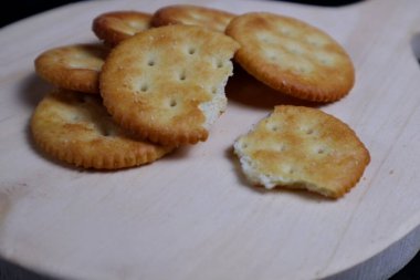 Close up of stack of round saltine crackers clipart