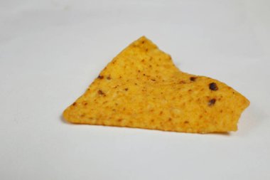 Close up of Crispy corn tortilla nacho chips in wooden plate clipart