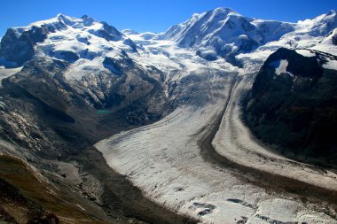 View of the snow-white Matterhorn glacier with a small lake from Mount Gornergrat near Zermatt in southern Switzerland