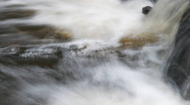 Close-up of water in waterfall in the nature in winter
