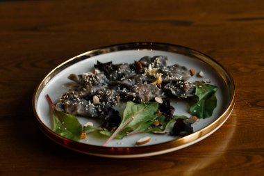 Baked or fried salmon and salad, Paleo, keto, fodmap, dash diet. Mediterranean food with steamed fish. Oven asian dish with teriyaki. Healthy concept, gluten free, lectine free, side view. High quality photo