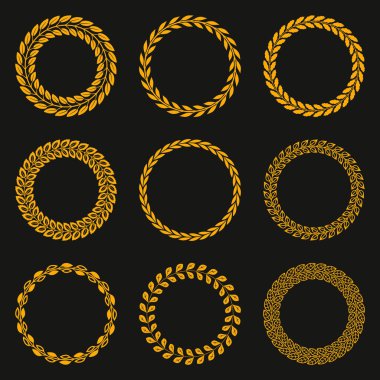 Golden vector laurel wreaths on black background.
