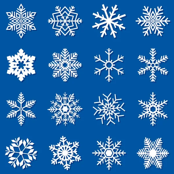 Kış tasarımı için mavi arka planda büyük beyaz kar taneleri..