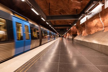 Stockholm, Sweden - January 07, 2023: Stockholm Radhuset metro station train passing by clipart
