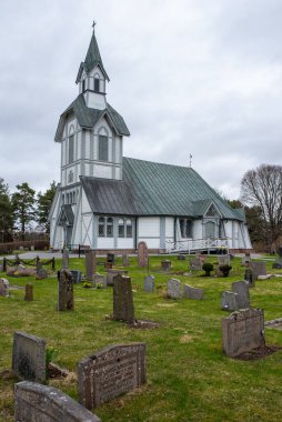 Ljuster, Sweden - April 13, 2024: Ljuster kyrka (Ljuster church), old wooden church built in 1755, architected by Hjalmar Kumlien clipart