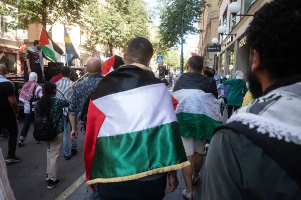 stock image Stockholm, Sweden - August 24, 2024: People cheering at Pro-Palestinian support meeting in Stockholm city center