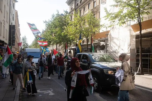 stock image Stockholm, Sweden - August 24, 2024: People cheering at Pro-Palestinian support meeting in Stockholm city center