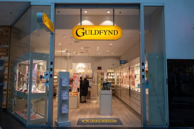 Stockholm, Sweden - February 4, 2025: Guldfynd, Swedish chain of stores that sells jewelry, store entrance with sign clipart