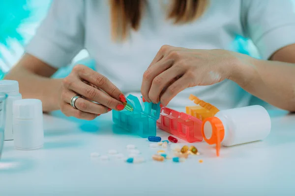 stock image Medicine non adherence. Woman holding pills in her hand, not sure if she had taken the medicine or not 