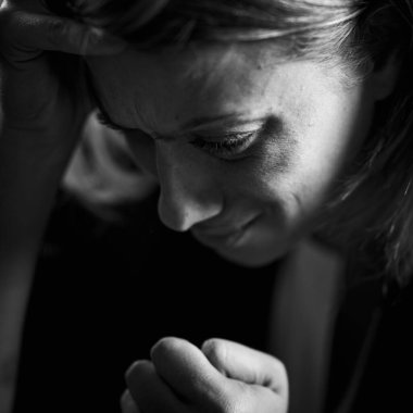 Phobia  Portrait of a fearful troubled woman on a dark background 