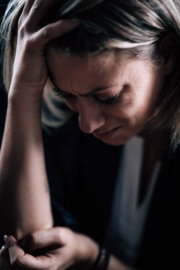 Fear and anxiety, female face expressing strong negative emotions