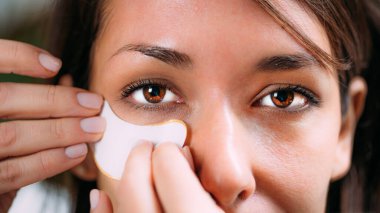 Beautiful Woman Using UnderEye Patches