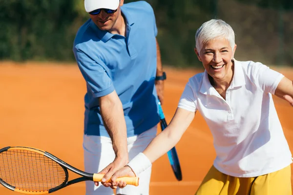 Active Senior Woman Practicing Tennis — Stock Photo, Image