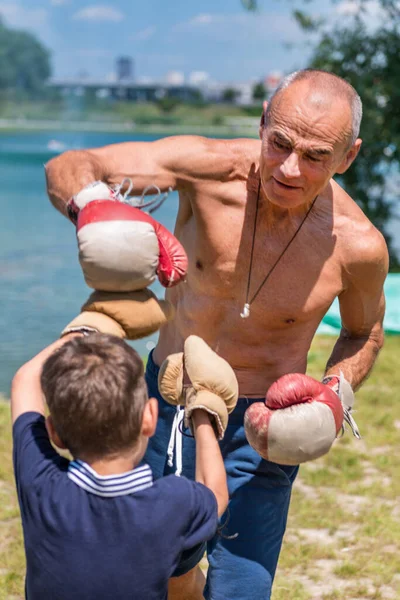 Athletic Grandfather Playfully Spars His Enthusiastic Year Old Grandson Fostering — Stock Photo, Image