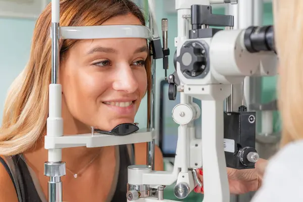Precise applanation tonometry and eye pressure test in ophthalmology, crucial for assessing eye health in a clinical setting.