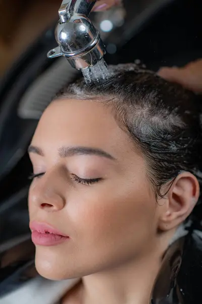 stock image Professional hair care with a shampooing session at the salon, ensuring clean and revitalized hair
