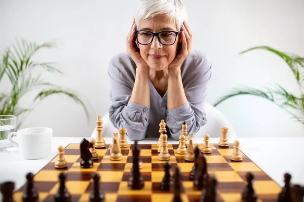 stock image Chess helps seniors enhance cognitive skills and memory, part of cognitive rehabilitation therapy