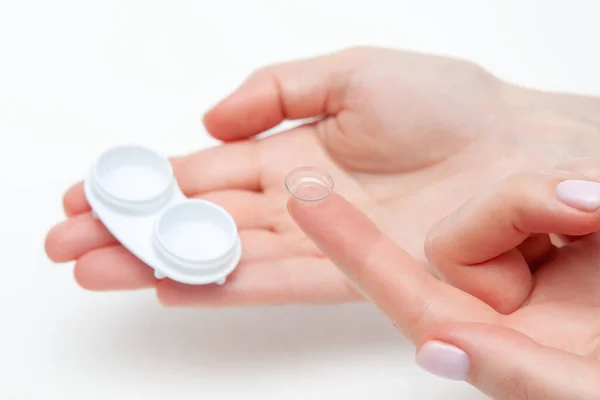 stock image Contact Eye Lenses. Woman Hands Holding Contact Eye Lens. Woman Hands Holding White Eye lens Container. Beautiful Woman Fingers Holding Eye Lens Box. Health And Eyes Care Concept. High Resolution