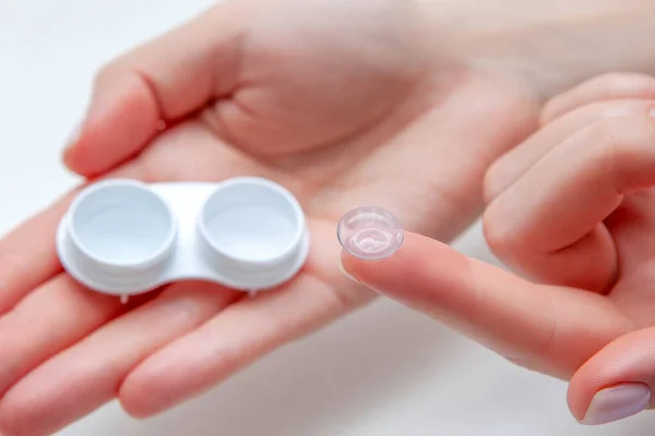 Contact Eye Lenses. Woman Hands Holding Contact Eye Lens. Woman Hands Holding White Container. Beautiful Woman Fingers Holding Eye Lens Box. Health And Eyes Care Concept. High Resolution