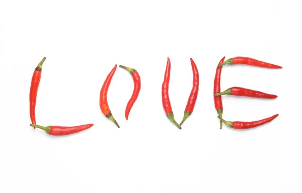 stock image Word love made from red chili peppers isolated on white background